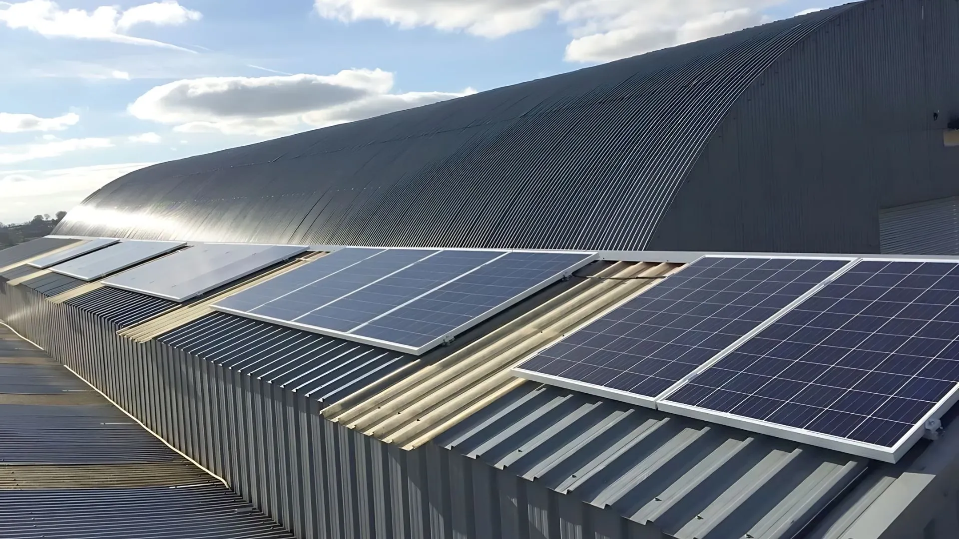 Sections of solar panels installed on top of farm buildings