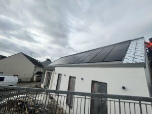 Alternative Energy Dromore Co. Tyrone building exterior during construction and installation of in-roof solar photovoltaic PV system.