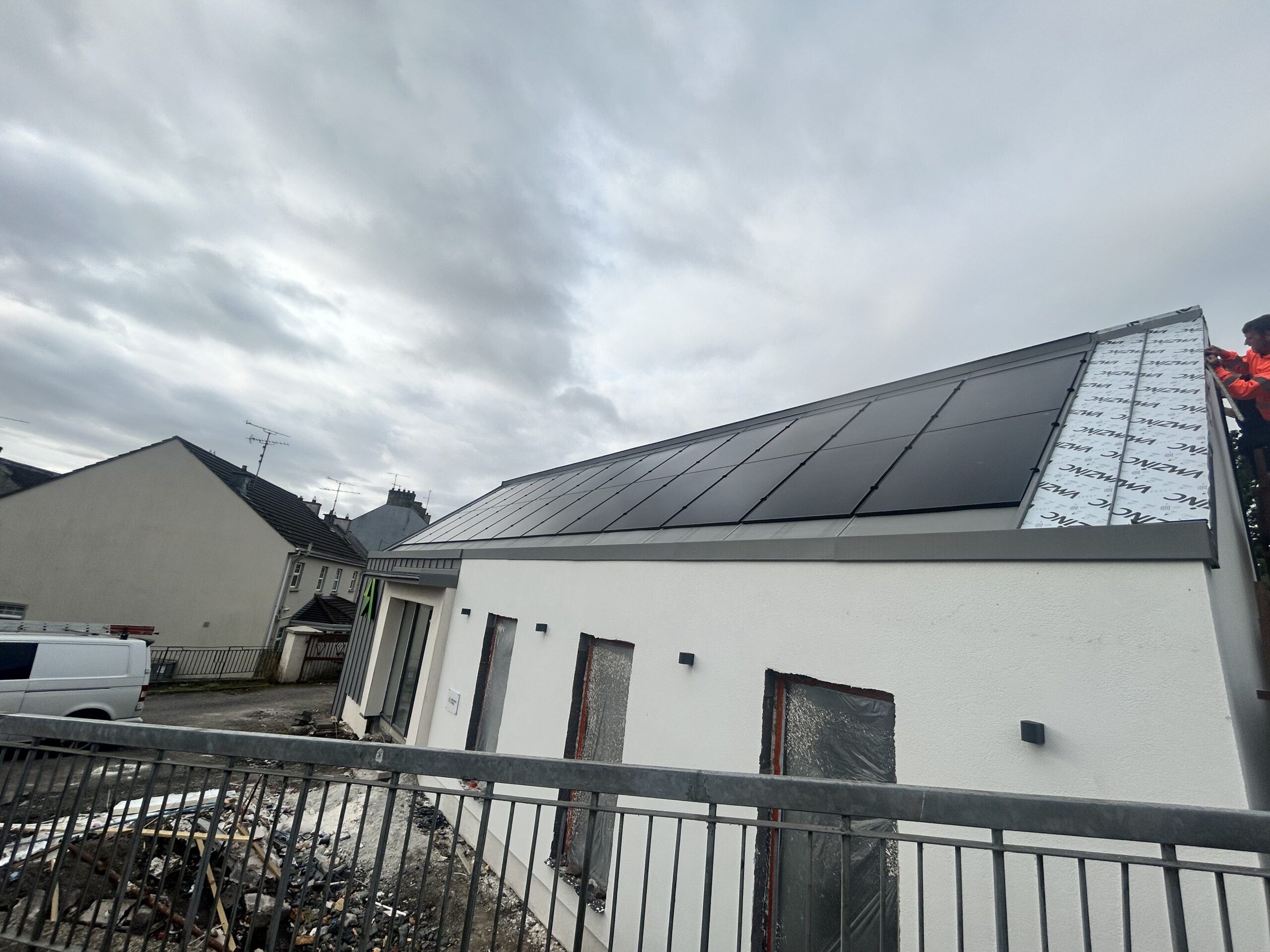 Alternative Energy Dromore Co. Tyrone building exterior during construction and installation of in-roof solar photovoltaic PV system.