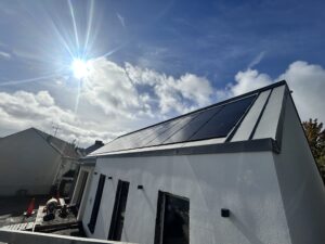 Alternative Energy Dromore Co. Tyrone building exterior during construction and installation of in-roof solar photovoltaic PV system.